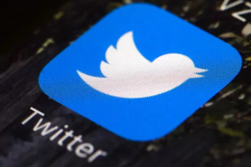 FILE- The Twitter icon is displayed on a mobile phone in Philadelphia on April 26, 2017.   Twitter said in a statement Friday, April 15, 2022,  that its board of directors has unanimously adopted a “poison pill” defense in response to Tesla CEO Elon Musk’s proposal to buy the company and take it private.   (AP Photo/Matt Rourke, File)