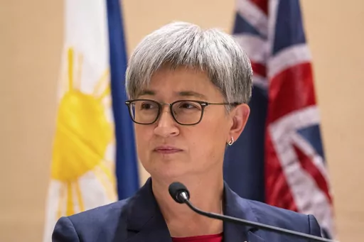 Australian Foreign Minister Penny Wong listens beside Philippine Foreign Affairs Secretary Enrique Manalo during a joint press conference at a hotel in Makati City, Philippines on Thursday May 18, 2023. An 88-year-old Australian doctor held captive in West Africa for more than seven years has been released, the Australian government said on Friday, May 19.(Lisa Marie David/Pool Photo via AP, File)