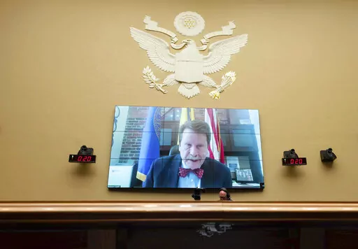 Food and Drug Administration Commissioner Robert Califf testifies via video during a House Commerce Oversight and Investigations subcommittee hybrid hearing on the nationwide baby formula shortage on Wednesday, May 25, 2022, in Washington. Califf has spent much of his last year on the job warning that growing “distortions and half-truths” surrounding vaccines and other medical products are a major driver of sickness and death in America. (AP Photo/Kevin Wolf, File)