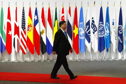 Chinese President Xi Jinping arrives at the G-20 leaders summit in Osaka, western Japan, on June 28, 2019. After a lengthy absence from major international gatherings, Chinese leader Xi is leaving his country's COVID bubble and venturing abroad next week into a dramatically changed world marked by rising confrontation. Xi will attend the G-20 meeting of industrial and emerging market nations in Indonesia followed by the Asia-Pacific Economic Cooperation summit in Thailand. (Kim Kyung-Hoon/Pool P
