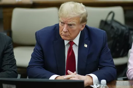 Former President Donald Trump, center, sits at the defense table with his attorney's Christopher Kise, left, and Alina Habba, at New York Supreme Court, Thursday, Dec. 7, 2023, in New York. (AP Photo/Eduardo Munoz Alvarez, Pool, File)