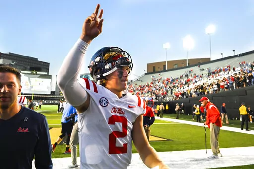 Mississippi quarterback Jaxson Dart (2) gestures as he walks off the field after an NCAA college football game against Vanderbilt, Saturday, Oct. 8, 2022, in Nashville, Tenn. Mississippi won 52-28. (AP Photo/John Amis)