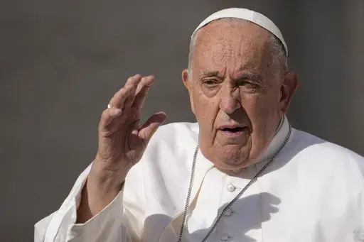 Pope Francis arrives for his weekly general audience in St. Peter's Square, at the Vatican, Wednesday, May 22, 2024. Pope Francis apologized Tuesday, May 28, 2024, after he was quoted using a vulgar term about gays to reaffirm the Catholic Church’s ban on gay priests. Vatican spokesman Matteo Bruni issued a statement acknowledging the media storm that erupted about Francis’ comments, which were delivered behind closed doors to Italian bishops on May 20. (AP Photo/Andrew Medichini, File)