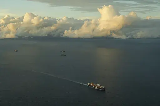 A cargo ship sails toward the Pacific Ocean waiting to transit the Panama Canal in Panama City, June 28, 2024. (AP Photo/Matias Delacroix, File)
