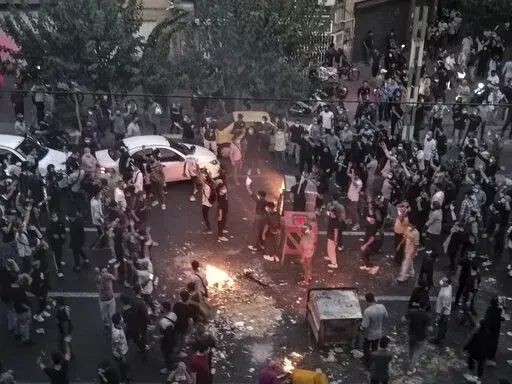 Iranians protest a 22-year-old woman Mahsa Amini's death after she was detained by the morality police, in Tehran, Sept. 20, 2022, in this photo taken by an individual not employed by the Associated Press and obtained by the AP outside Iran. Iran’s atomic energy agency alleged Sunday, Oct. 23, 2022, that hackers acting on behalf of an unidentified foreign country broke into a subsidiary’s network and had free access to its email system. Sunday's hack comes as Iran continues to face nationwid