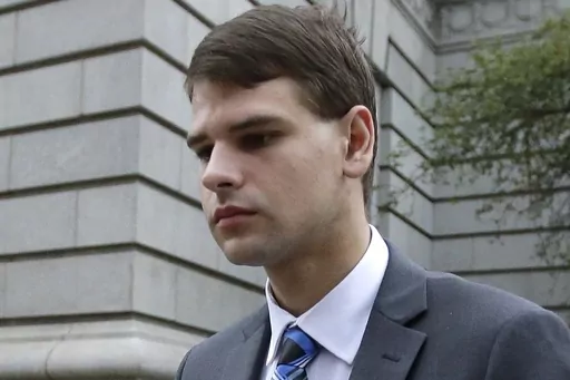 Nathan Carman leaves federal court in Providence, R.I., Aug. 21, 2019. An autopsy has determined that Carman's death while he was awaiting trial on charges of killing his mother off the coast of New England in a scheme to inherit millions of dollars was not suspicious, the New Hampshire attorney general's office said Wednesday, June 28, 2023. Twenty-nine-year-old Carman was found dead in his cell in a county jail in New Hampshire on June 15. (AP Photo/Steven Senne, File)