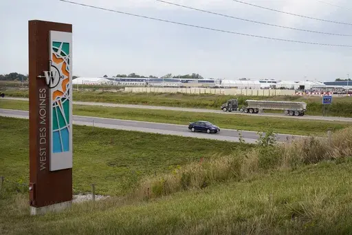 Traffic on Interstate 35 passes a Microsoft data center on Sept. 5, 2023, in West Des Moines, Iowa. Artificial intelligence systems like ChatGPT could soon run out of what keeps making them smarter — the tens of trillions of words that people have written and shared online. (AP Photo/Charlie Neibergall, File)