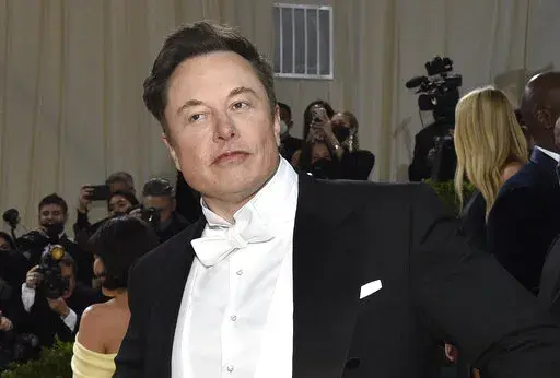 Elon Musk attends The Metropolitan Museum of Art's Costume Institute benefit gala celebrating the opening of the "In America: An Anthology of Fashion" exhibition on May 2, 2022, in New York. Twitter's stock slid more than 6% before the market open Monday, July 11, 2022, after billionaire Elon Musk announced late Friday that he will abandon his $44 billion offer to buy Twitter and the company said it will sue the Tesla CEO to uphold the deal.(Photo by Evan Agostini/Invision/AP/File)