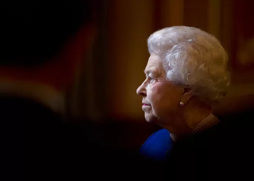 In this Dec. 18, 2012 file photo Britain's Queen Elizabeth II escorted by British Foreign Secretary William Hague, unseen, tours The Foreign and Commonwealth Office during an official visit which is part of her Jubilee celebrations in London.  Queen Elizabeth II, Britain’s longest-reigning monarch and a rock of stability across much of a turbulent century, has died. She was 96. Buckingham Palace made the announcement in a statement on Thursday Sept. 8, 2022. (AP Photo/Alastair Grant, Pool, Fil