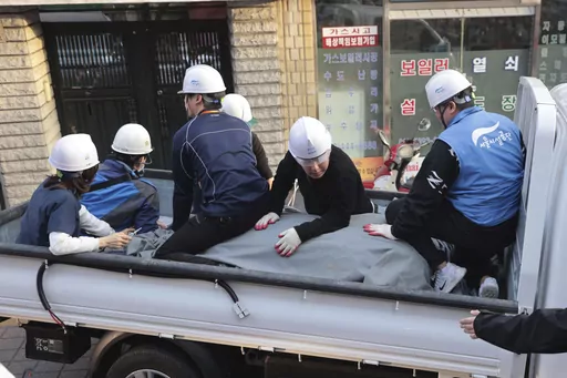 Authorities of Seoul Metropolitan Facilities Management Corporation transport a zebra which escaped from a zoo, in Seoul, South Korea, Thursday, March 23, 2023. A young zebra walked, trotted, and galloped for hours in the busy streets of South Korea’s capital before emergency workers tranquilized the animal and brought it back to a zoo. Choi Ye-ra, an official at the Children’s Grand Park in Seoul, said the 2-year-old male zebra was in stable condition and being examined by veterinarians. Sh
