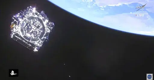 This photo provided by NASA, the James Webb Space Telescope is separated in space on Saturday, Dec. 25, 2021.  NASA's James Webb Space Telescope soared from French Guiana on South America’s northeastern coast, riding a European Ariane rocket into the Christmas morning sky.  The $10 billion infrared observatory is intended as the successor to the aging Hubble Space Telescope. (NASA via AP)