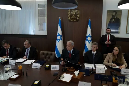 Israel's Prime Minister Benjamin Netanyahu, center, chairs the weekly cabinet meeting in Jerusalem, Sunday, Jan. 22, 2023. (AP Photo/Maya Alleruzzo, Pool)