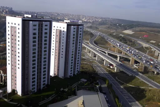 A view of two buildings part of a residential compound in Istanbul, Tuesday, Dec. 8, 2022. Economic turmoil driven by inflation of 85% has plunged Turkey into one of its worst property crises. Skyrocketing prices have made finding affordable housing to rent or buy an uphill battle for many, especially for millions earning minimum wage who also struggle to cover food and energy costs. Increasing construction costs and inflation have pushed up housing prices globally. (AP Photo/Khalil Hamra)