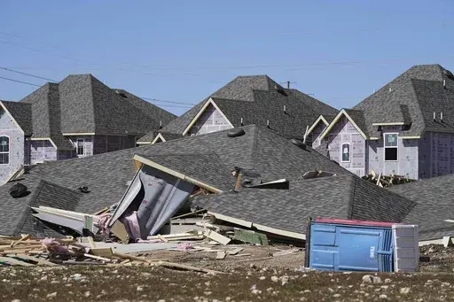 Homes that were under construction sit destroyed after recent severe weather that passed through the area in Haslet, Texas, Wednesday, March 5, 2025. (AP Photo/Tony Gutierrez)