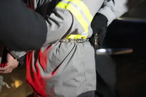 U.S. Immigration and Customs Enforcement officers detain someone during an enforcement operation, Jan. 27, 2025, in Silver Spring, Md. (AP Photo/Alex Brandon, File)