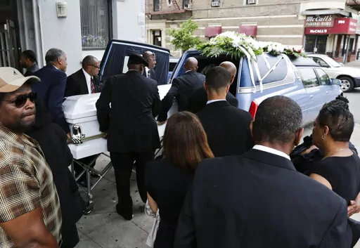 In this June 16, 2015 file photo, the casket bearing Kalief Browder is loaded into a hearse after his funeral service in the Bronx borough of New York. Two years into New York's bold quest to eliminate pretrial incarceration for most crimes, state officials are considering abandoning some bail reforms, and locking up more people upon arrest — amid public pressure to curb rising violence. Browder spent three years at New York City's notorious Rikers Island jail complex — including nearly two 
