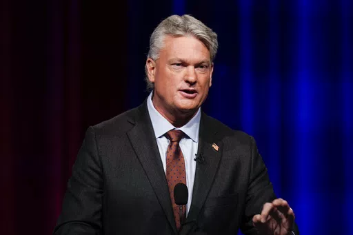 Mike Collins participates in a Republican primary debate for Georgia's 10th Congressional District, June 6, 2022, in Atlanta. Collins, who won a U.S. House seat in 2022, issued a statement Monday, May 6, 2024, saying that he stands by his admiration of college students who push back against those protesting the Israel-Hamas war, but he backtracked somewhat on his earlier praise of a counter-protest at the University of Mississippi that included a man appearing to make monkey noises and gestures 