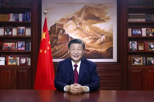 In this photo released by Xinhua News Agency, Chinese President Xi Jinping delivers a New Year address in Beijing, Saturday, Dec. 31, 2022. China "stands on the right side of history," the country's leader Xi Jinping said Saturday in a New Year's address that came as questions swirl over his government's handling of COVID-19 and economic and political challenges at home and abroad. (Ju Peng/Xinhua via AP)