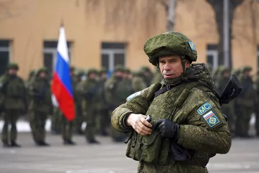 A Russian officer of the Collective Security Treaty Organization peacekeepers attends the official ceremony of starting withdraw its troops in Almaty, Kazakhstan, Thursday, Jan. 13, 2022. In light of unprecedented mass protests that quickly grew violent, Kazakh President Kassym-Jomart Tokayev requested help from the Collective Security Treaty Organization, a Russia-led military alliance of six ex-Soviet states. The bloc sent over 2,000 troops to Kazakhstan last week, and on Tuesday Tokayev decla