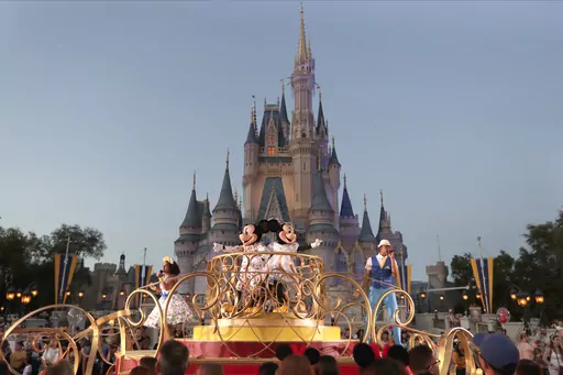 Mickey and Minnie Mouse perform during a parade as they pass by the Cinderella Castle at the Magic Kingdom theme park at Walt Disney World in Lake Buena Vista, Fla., on Jan. 15, 2020. After appointees of Florida Gov. Ron DeSantis took over Walt Disney World’s governing district in 2023, its firefighters were among the few employees who publicly welcomed them with open arms. But that warm relationship is in jeopardy now as a new administrator has reopened negotiations on a new contract that pro