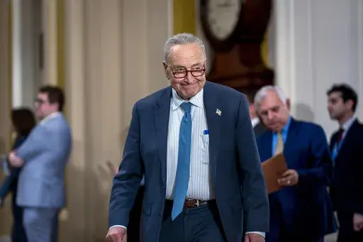 Senate Majority Leader Chuck Schumer, D-N.Y., arrives to update reporters on efforts to fund the government before the midnight Friday deadline, at the Capitol in Washington, Tuesday, Dec. 17, 2024. Congressional leaders are nearing the unveiling of an agreement that will keep the federal government funded through March 14 and provide more than $100 billion in emergency aid to help states and local communities recover from Hurricanes Helene and Milton, and other natural disasters. (AP Photo/J. S