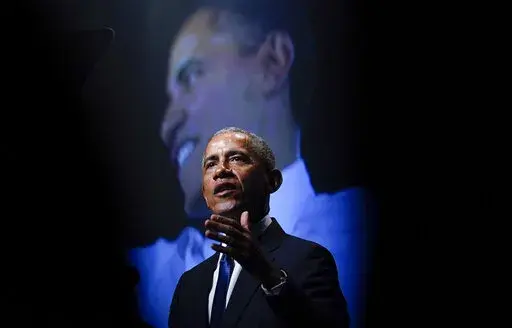 Former President Barack Obama speaks during a memorial service for former Senate Majority Leader Harry Reid at the Smith Center in Las Vegas, Jan. 8, 2022. Former President Obama said on Sunday, March 13, 2022 that he had tested positive for the coronavirus, though he's feeling relatively healthy and his wife, Michelle, tested negative. (AP Photo/Susan Walsh, file)