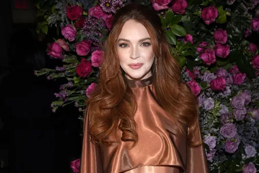 Lindsay Lohan appears the Christian Siriano Fall/Winter 2023 fashion show in New York on Feb. 9, 2023. Lohan is expecting her first child. The “Mean Girls” star announced her pregnancy on Instagram on Tuesday. (Photo by Charles Sykes/Invision/AP, File)