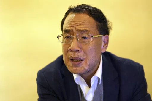 Virologist Zhang Yongzhen speaks at a coffeeshop in Shanghai, China on Dec. 13, 2020. Zhang, the first scientist to publish a sequence of the COVID-19 virus in China was staging a sit-in protest after authorities locked him out of his lab. Zhang wrote in an online post on Monday, April 29, 2024, that he and his team were suddenly notified they were being evicted from their lab, the latest in a series of setbacks, demotions and ousters since he first published the sequence in early January 2020. 