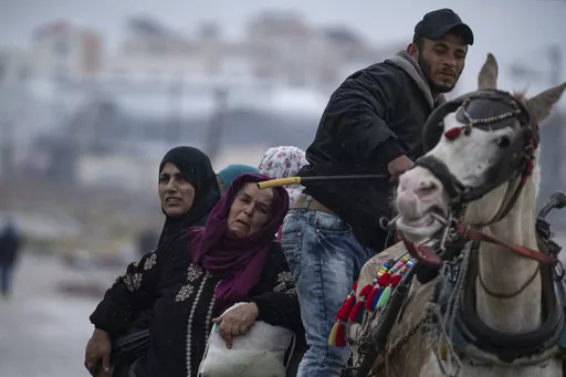 Palestinians arrive in the southern Gaza town of Rafah after fleeing an Israeli ground and air offensive in the nearby city of Khan Younis on Monday, Jan. 29, 2024. Israel has expanded its offensive in Khan Younis, saying the city is a stronghold of the Hamas militant group. (AP Photo/Fatima Shbair)