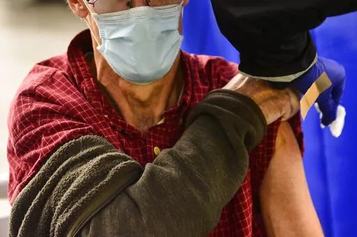 A man receives a flu shot in Brattleboro, Vt., on Tuesday, Oct. 26, 2021. Doctors have a message for vaccine-weary Americans: Don't skip your flu shot this fall 2022. And for the first time, seniors are urged to get a special extra-strength kind. (Kristopher Radder/The Brattleboro Reformer via AP, File)