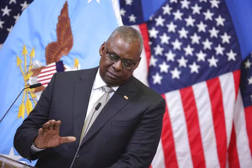 US Secretary of Defense Lloyd J. Austin III gestures as he speaks during a media conference after a meeting of NATO defense ministers at NATO headquarters in Brussels, Wednesday, Oct. 12, 2022. Ukrainian leaders are begging the U.S. and Western allies for air defense systems and longer-range weapons to keep up the momentum in their counteroffensive against Russia and fight back against Moscow’s intensified attacks. Austin says allies are committed to sending weapons “as fast as we can physic