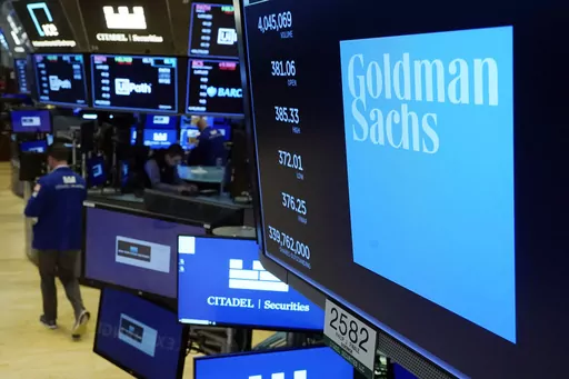 The logo for Goldman Sachs appears above a trading post on the floor of the New York Stock Exchange on July 13, 2021. Goldman Sachs has agreed Monday, May 8, 2023, to pay $215 million to settle a years-long class action lawsuit that claimed the bank discriminated against women when it came to pay, performance evaluations and promotions. (AP Photo/Richard Drew, File)
