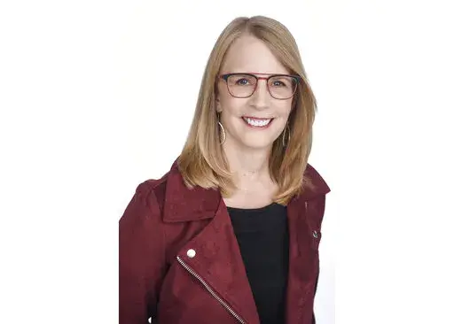 This undated file photo provided by NerdWallet shows Liz Weston, a columnist for personal finance website NerdWallet.com. While inflation is still hanging around, you can take three specific actions to better insulate your finances. First, reconsider your emergency fund. Yes, it can be too large — and you may be better off investing that cash. Next, review your home insurance coverage. Rebuilding costs are way up, and most people are underinsured anyway. Finally, check for “bracket creep” 