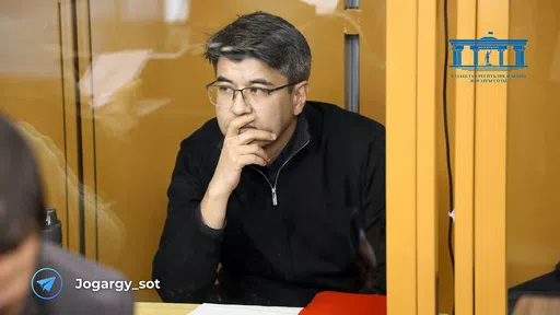 In this photo released by the Kazakhstan Supreme Court Press Office’s Telegram channel on Friday, April 12, 2024, businessman Kuandyk Bishimbayev, the country’s former economy minister, sits in a defendants’ cage at his trial in Astana, Kazakhstan. Bishimbayev is on trial for killing his wife, Saltanat Nukenova, and the case has touched a nerve in the Central Asian country, with tens of thousands of people signing petitions calling for harsher penalties for domestic violence. On April 11, 
