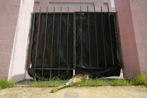 A bouquet of roses are left by the front gate to the Jackson Women's Health Organization clinic in Jackson, Miss., July 8, 2022. A group of anti-abortion doctors in Mississippi, where state leaders led the charge to overturn Roe v. Wade, say the validity of the state's law banning most abortions remains uncertain. In a lawsuit filed Monday, Nov. 14, 2022 in the Chancery Court of Hinds County, the doctors argue that another legal victory is required to enshrine the ban and protect them from punis