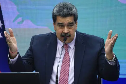 Venezuelan President Nicolas Maduro speaks during a press conference at Miraflores presidential palace in Caracas, Venezuela, Wednesday, Nov. 30, 2022. (AP Photo/Ariana Cubillos)