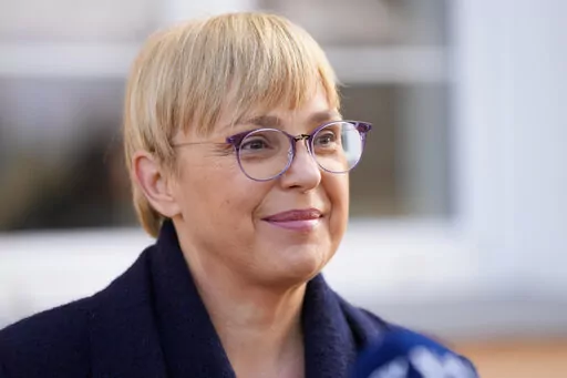 Liberal candidate Natasa Pirc Musarat addresses the media after her vote, outside a polling station in Radomlje near Ljubljana, Slovenia, Sunday, Nov. 13, 2022. Slovenian voters choose between center-right former foreign minister Anze Logar and Pirc Musar in the runoff of the presidential election. (AP Photo/Darko Bandic)