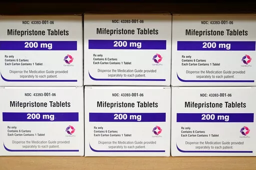 Boxes of the drug mifepristone sit on a shelf at the West Alabama Women's Center in Tuscaloosa, Ala., on March 16, 2022. Attorney generals in 20 conservative-led states warned CVS and Walgreens on Wednesday, Feb. 1, 2023, that they could face legal consequences if they sell abortion pills by mail in those states. (AP Photo/Allen G. Breed, File)