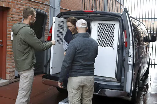 Naomi Bistline arrives at the federal courthouse in Flagstaff, Ariz., on Wednesday, Dec. 7, 2022. Bistline and two other women from a polygamous sect near the Arizona-Utah border are charged with kidnapping and impeding a foreseeable prosecution. (AP Photo/Jake Bacon)