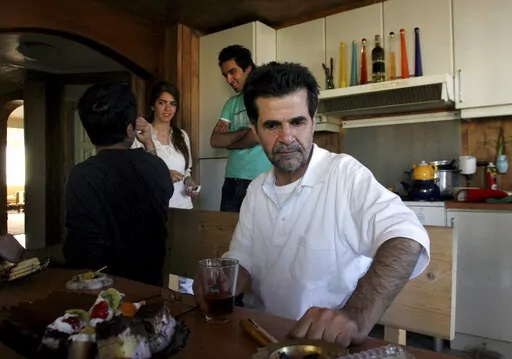 Iranian filmmaker Jafar Panahi is shown at his home after he was freed from jail on bail after more than two months in custody, in Tehran, Iran, on May 25, 2010 . Panahi who was arrested last summer, weeks before his latest film was released to widespread acclaim, has gone on hunger strike to protest his continued detention amid more than four months of anti-government protests. (AP Photo, File)