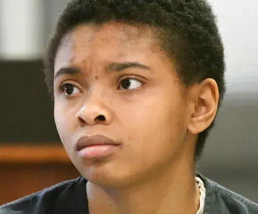 Chrystul Kizer sits in the Kenosha County Courthouse on Feb. 6, 2020, in Kenosha, Wis. Wisconsin's Supreme Court is set to decide Wednesday, July 6, 2022, whether Kizer, an alleged sex trafficking victim accused of homicide, can argue at trial that she was justified in killing the man who trafficked her, a ruling that could help define the extent of immunity for trafficking victims nationwide.  (Paul Williams/The Kenosha News via AP, File)