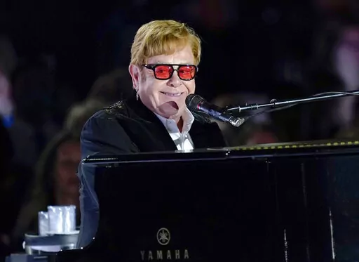 Elton John performs on the South Lawn of the White House in Washington, Friday, Sept. 23, 2022. Elton John is scheduled to perform at the Glastonbury Festival in June, in what organizers say will be his last-ever show in Britain. The festival announced Friday, Dec. 2, 2022 that the star will play the 2023 festival’s final night on June 25 (AP Photo/Susan Walsh, File)