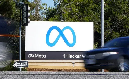 A car passes Facebook's new Meta logo on a sign at the company headquarters on Oct. 28, 2021, in Menlo Park, Calif. For years, Facebook, now called Meta, has pushed a narrative that it was a neutral platform in Myanmar that was misused by bad actors and failed to moderate violent and hateful material adequately. But a new report by Amnesty International says Facebook was not merely a passive site with insufficient content moderation. Rather, Meta’s algorithms “proactively amplified" material