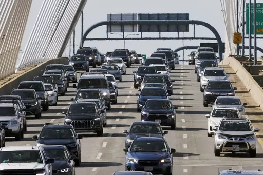 Heavy traffic heads south on Interstate 93 over the Zakim Bridge, Friday, Sep. 1, 2023, in Boston. Cars are getting an “F” in data privacy. A new study released Wednesday, Sept. 6, 2023, found that most major brands admit they may be selling your personal data, with half saying they will share it with the government or law enforcement without a court order. (AP Photo/Michael Dwyer, File)
