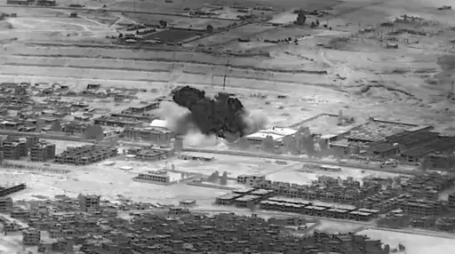 This image from video provided by the Department of Defense shows a Nov. 8, 2023, airstrike on a weapons warehouse. center, in eastern Syria. The strike targeted a facility linked to Iranian-backed militias, in retaliation for what has been a growing number of attacks on bases housing U.S. troops in the region for the past several weeks. Iranian-backed militants in Iraq and Syria have long battled with U.S. and coalition forces, launching sporadic attacks against bases in the region where troops
