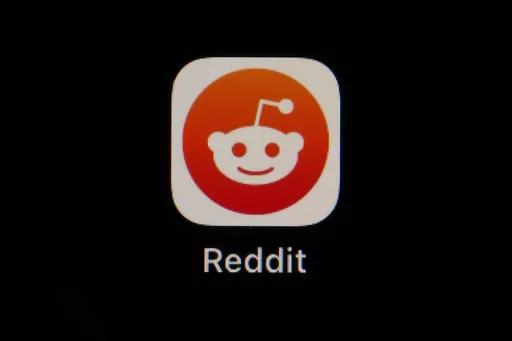 The Reddit app icon is seen on a smartphone, Feb. 28, 2023, in Marple Township, Pa. Reddit is due to begin trading on the New York Stock Exchange on Tuesday, March 21, 2024. (AP Photo/Matt Slocum, File)