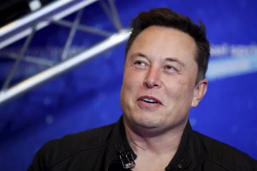 Tesla and SpaceX CEO Elon Musk arrives on the red carpet for the Axel Springer media award in Berlin on Dec. 1, 2020. Musk says he plays on remaining as Twitter’s CEO until he can find someone willing to replace him in the job. Musk's announcement came after millions of Twitter users asked him to step down in an unscientific poll the billionaire himself created and promised to abide by. (Hannibal Hanschke/Pool Photo via AP, File)