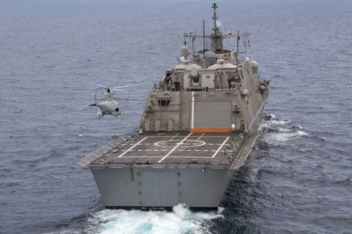An MQ-8B Fire Scout unmanned aerial vehicle assigned to the Black Knights of Helicopter Sea Combat Squadron (HSC) 22 conducts flight operations during an underway with the USS Milwaukee (LCS 5) on June 27, 2019 in the Atlantic Ocean. The ship remains in port at Naval Station Guantanamo Bay in Cuba, with about two dozen sailors, or nearly a quarter of its crew, testing positive for COVID-19, according to U.S. defense officials.(Mass Communication Specialist 2nd Class Anderson W. Branch/U.S. Navy 