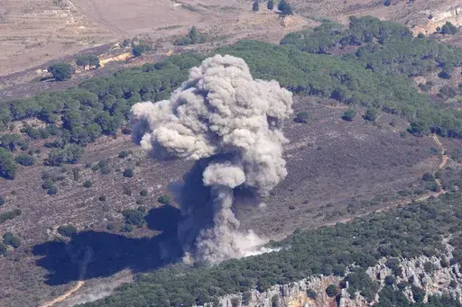 Smoke rises from an Israeli airstrike on the Mahmoudieh mountain, as seen from Marjayoun town, south Lebanon, Tuesday, Sept. 24, 2024. (AP Photo/Hussein Malla)