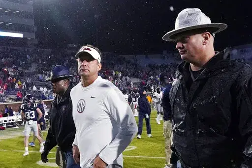 Mississippi coach Lane Kiffin leaves the field following the team's 24-22 loss to Mississippi State in an NCAA college football game in Oxford, Miss., Thursday, Nov. 24, 2022. (AP Photo/Rogelio V. Solis)